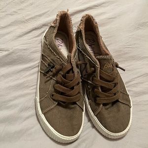 Army green canvas slip ons.